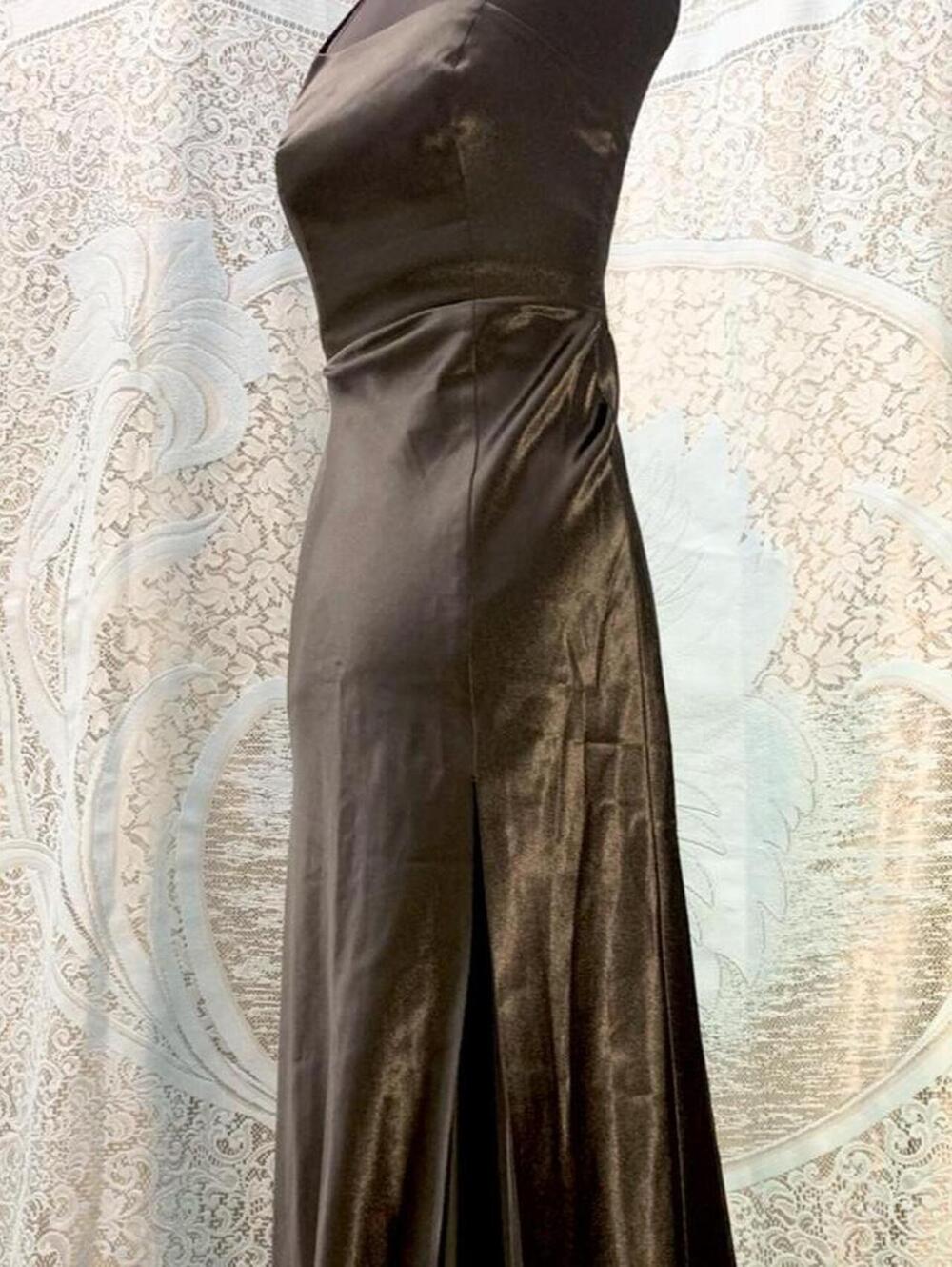 Black evening formal party dress with leg slit and asymmetrical neckline.